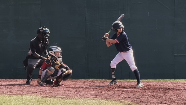 Jameson at bat playing baseball