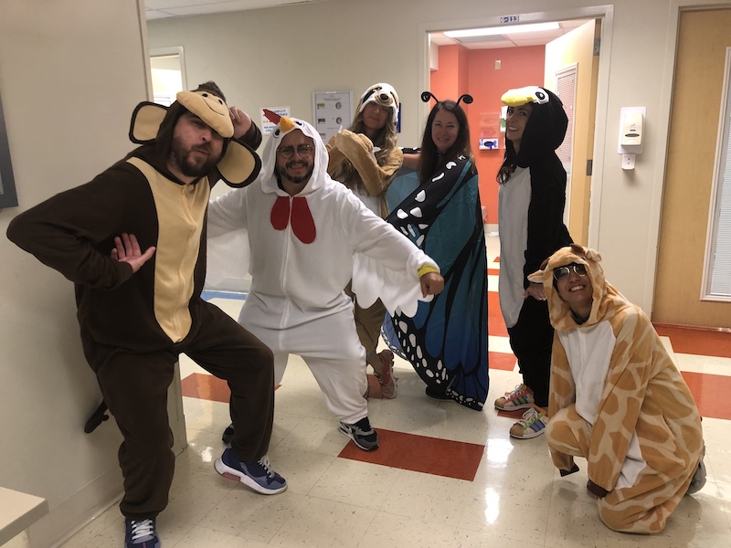 students in animal onesie costumes for halloween event.