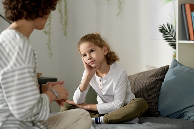 Upset girl listening to mom talking