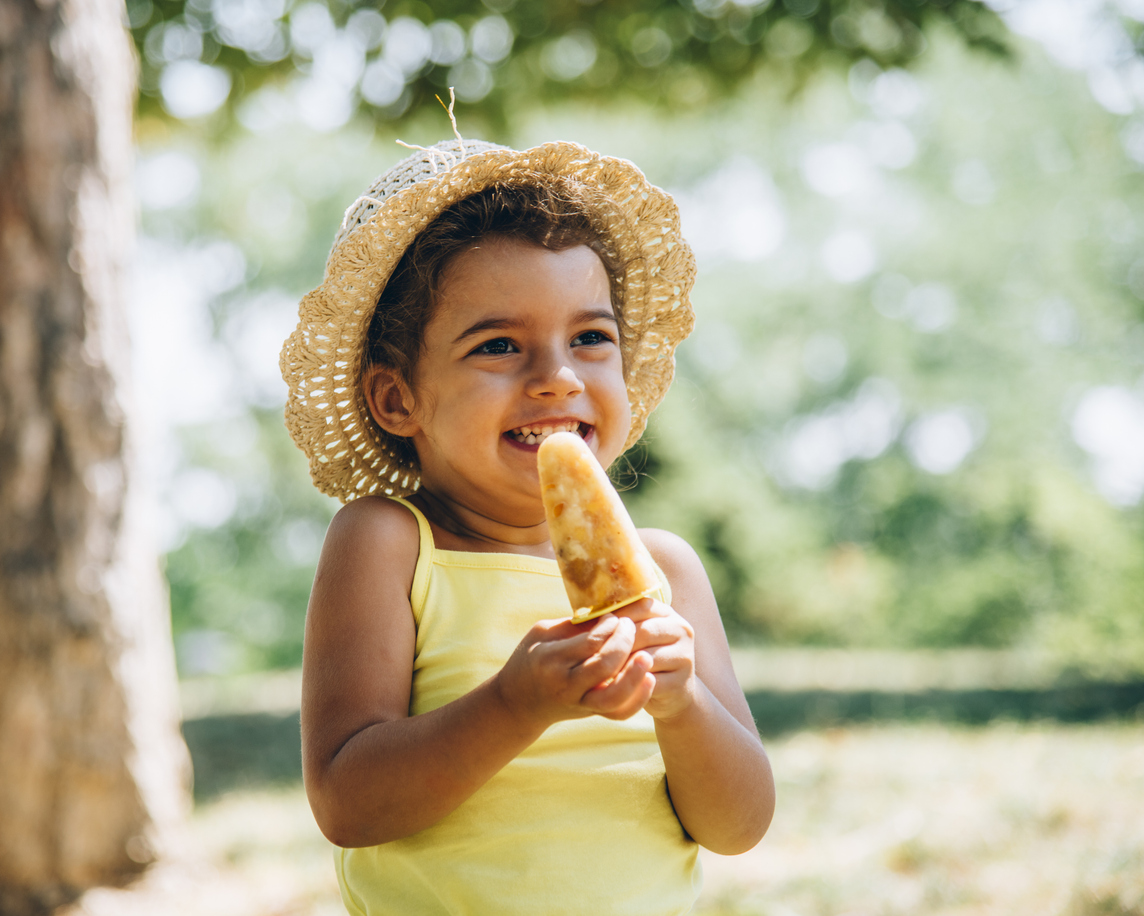 Girl eating popsicle