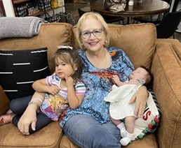 Jackie with her grandkids.