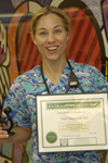 awardee wearing a headband of daisies, daisy award statue, and certificate.