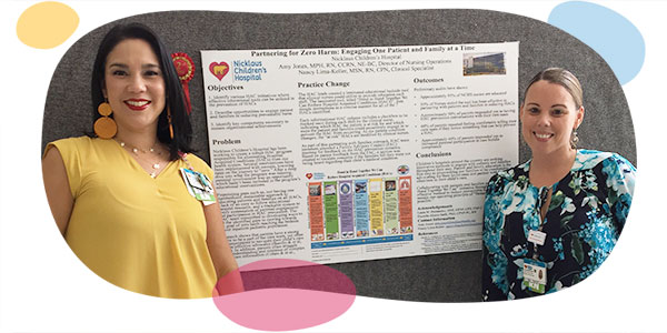 smiling nurses of diverse backgrounds during an education fair