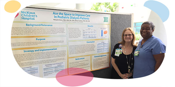 nurses posing next to presentation poster.