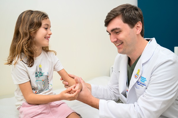 Dr. Utset-Ward with young girl patient