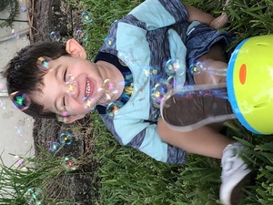 Jaxon playing with a bubble machine