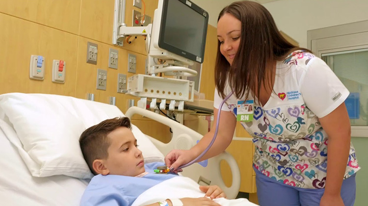 nurse practitioner attending a hospitalized boy