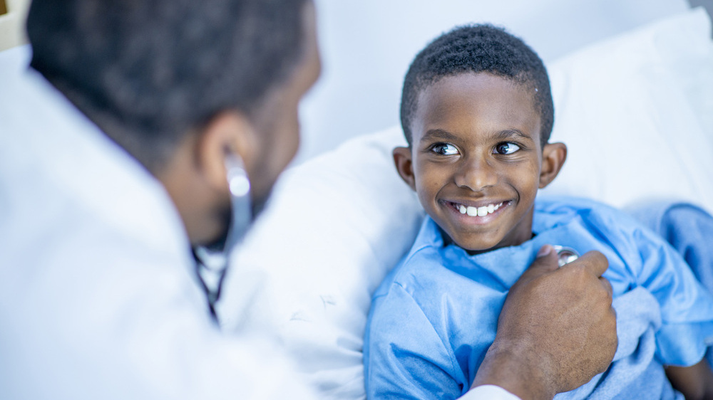 Patient smiling in bed
