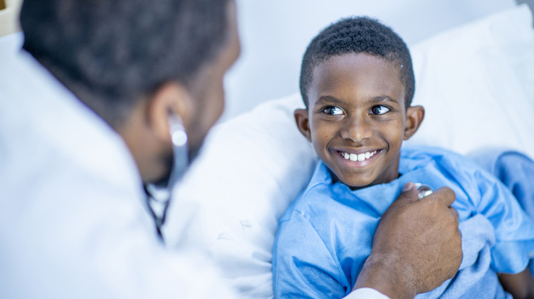 Patient smiling in bed