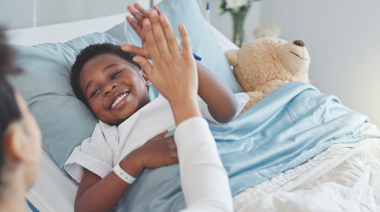 Patient on bed with bear