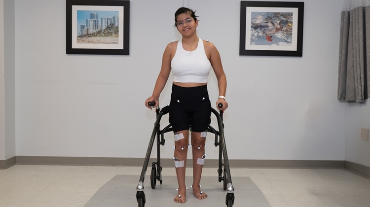 Female patient being measured by Gait Analysis Lab team