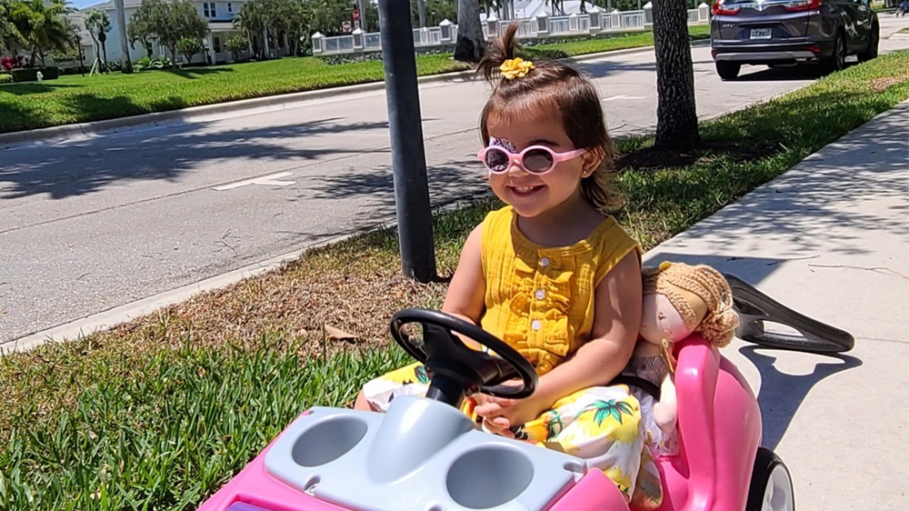 patient Bruna in toy car wagon
