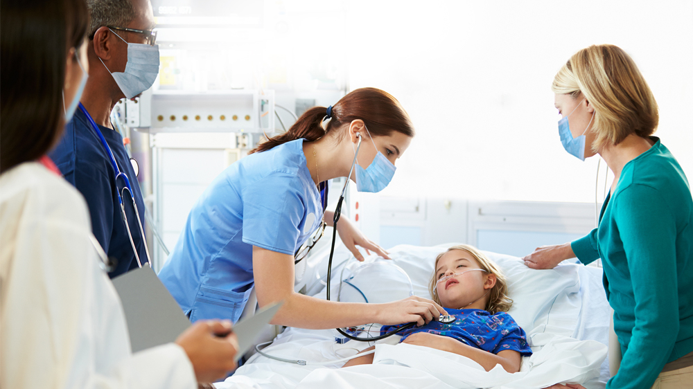 Girl receiving care and support from medical team.