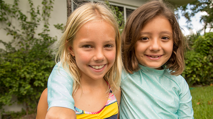 two girls smiling