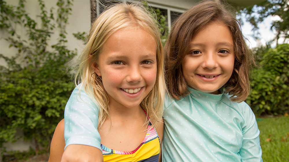 two girls smiling