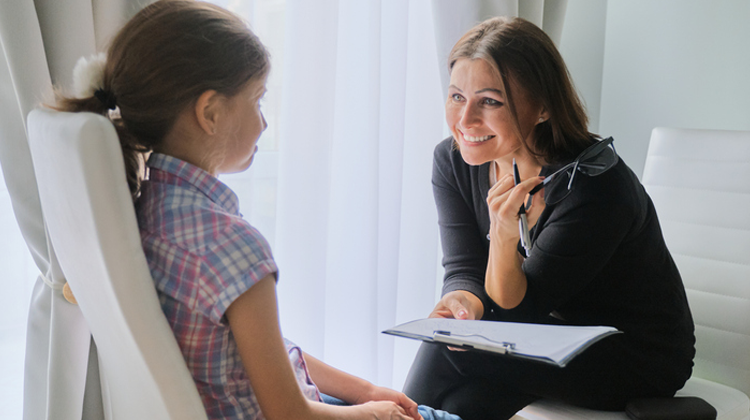 Elementary school teacher testing young girl