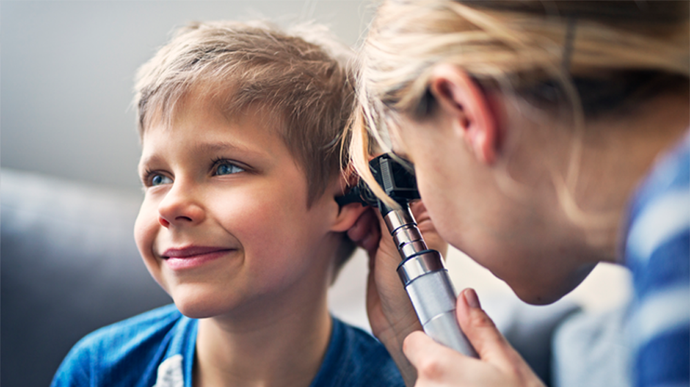 boy receiving ear exam