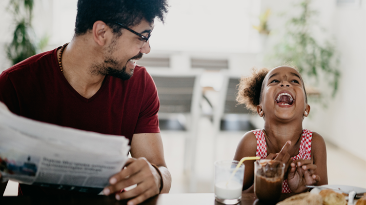 father and daughter eating