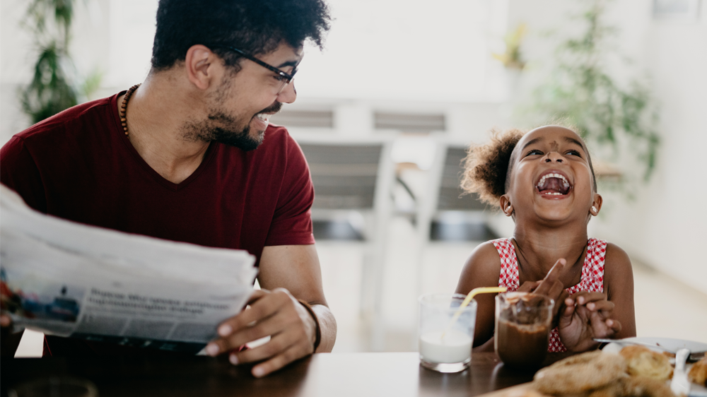 father and daughter eating