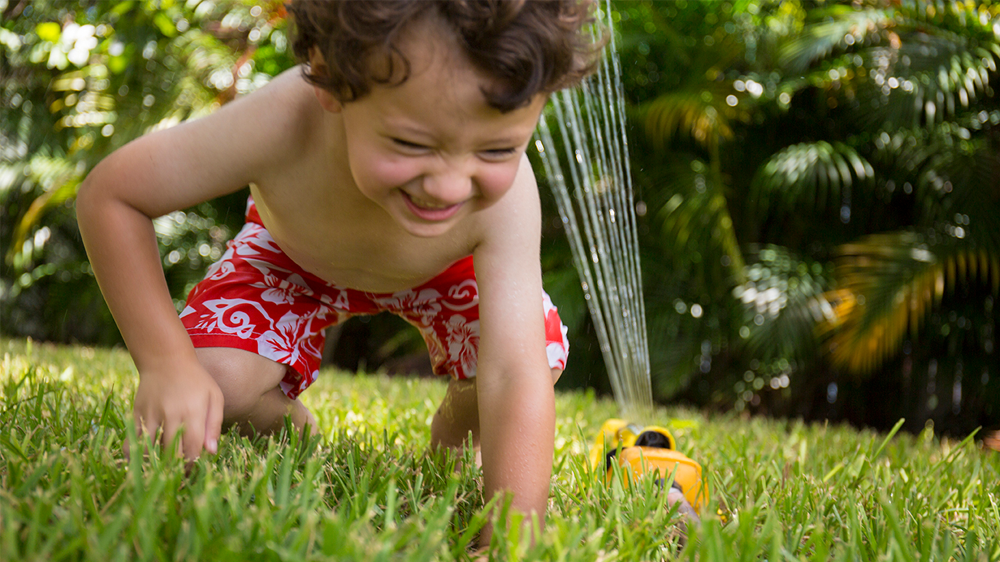 boy playing outside on the yard.