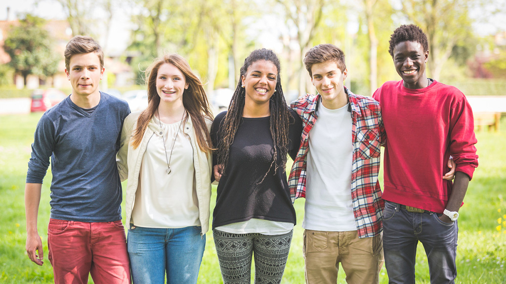 group of teenage boys and girls standing together