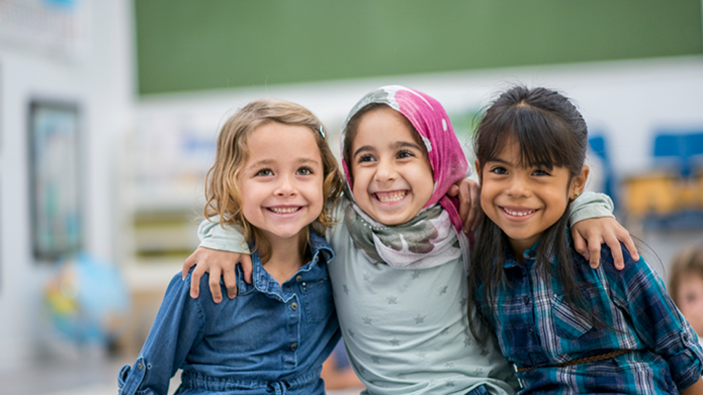 three children smiling