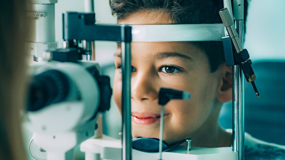 child with eye doctor