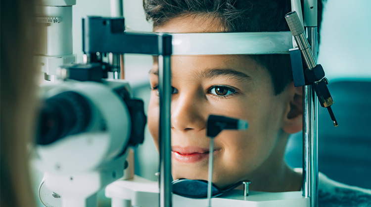 child with eye doctor