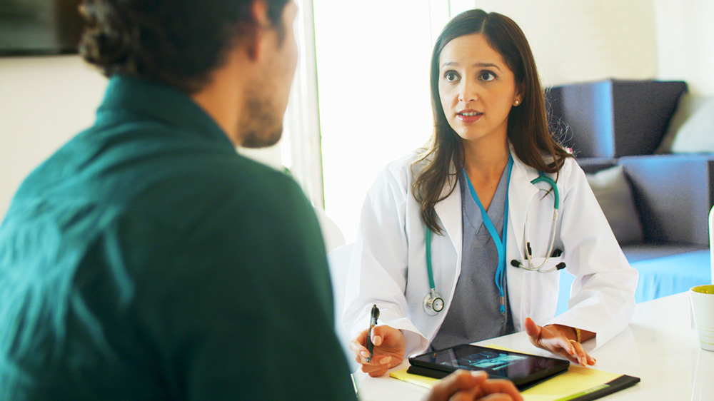 young female physician during a conversation with a outreach representative