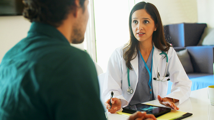 young female physician during a conversation with a outreach representative