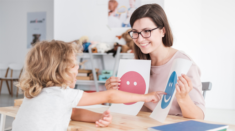 child and therapist during a session.