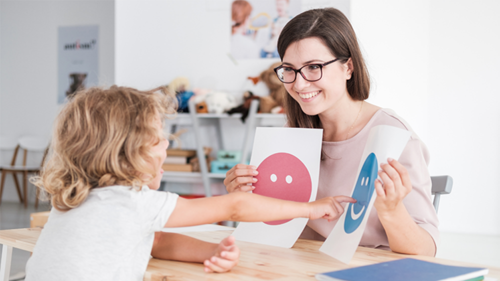 child and therapist during a session.