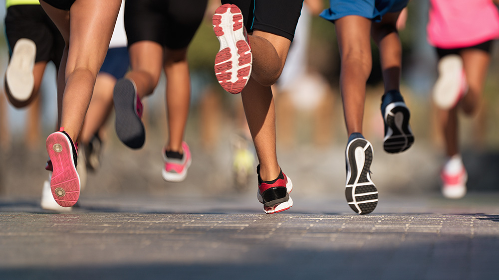 view of running feet and legs