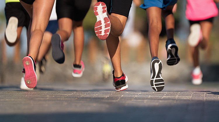 view of running feet and legs