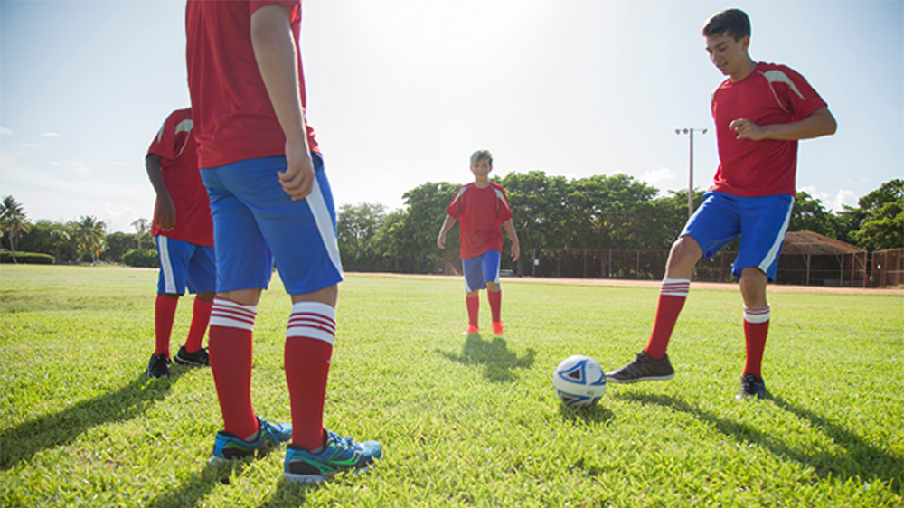 children playing soccer