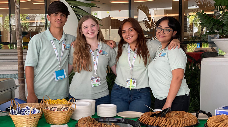 high school volunteers on campus