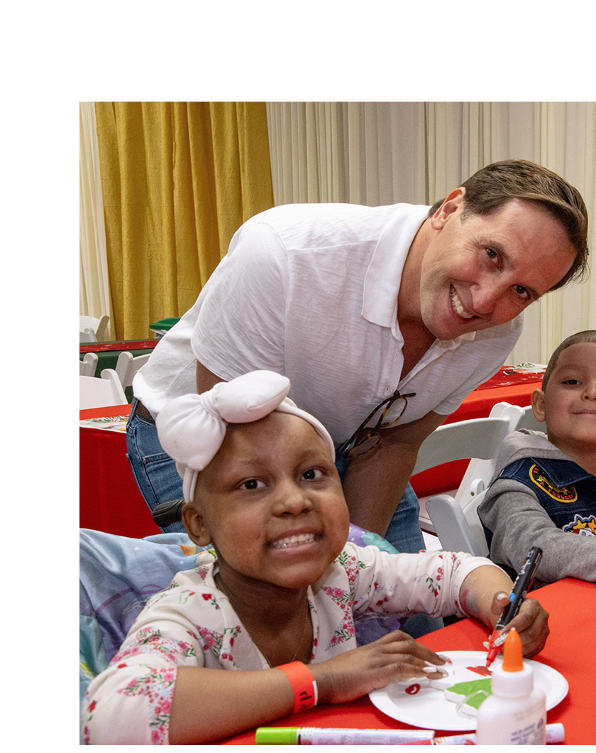 spiderman character posing with patient.