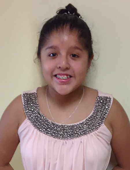 smiling girl with OFS in pink tank top.