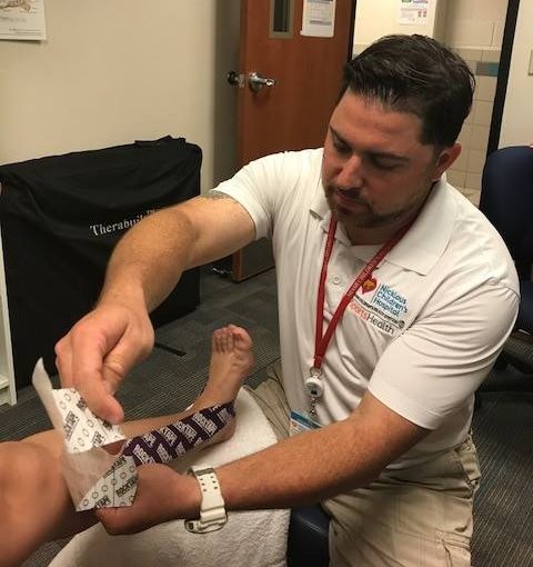 ATC treating an injury