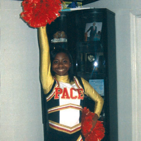 Bria in her cheerleading uniform