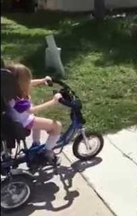 Maddy riding a bike