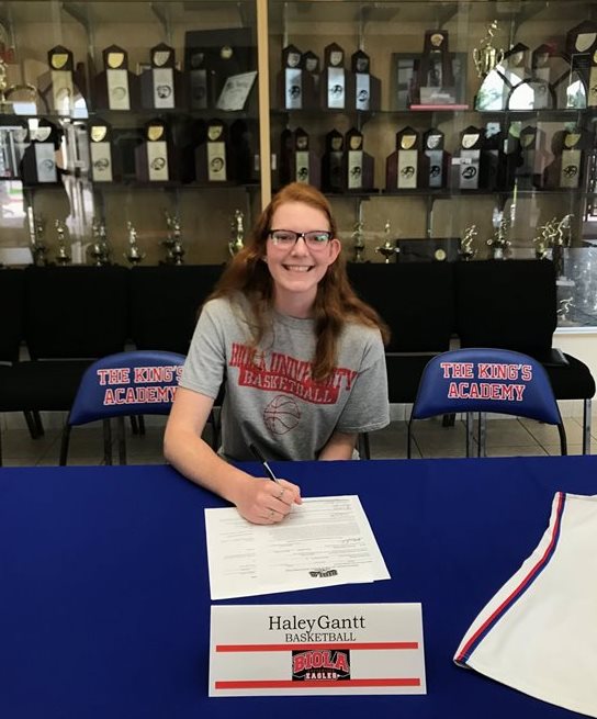 Haley signing documents at Haley Gantt