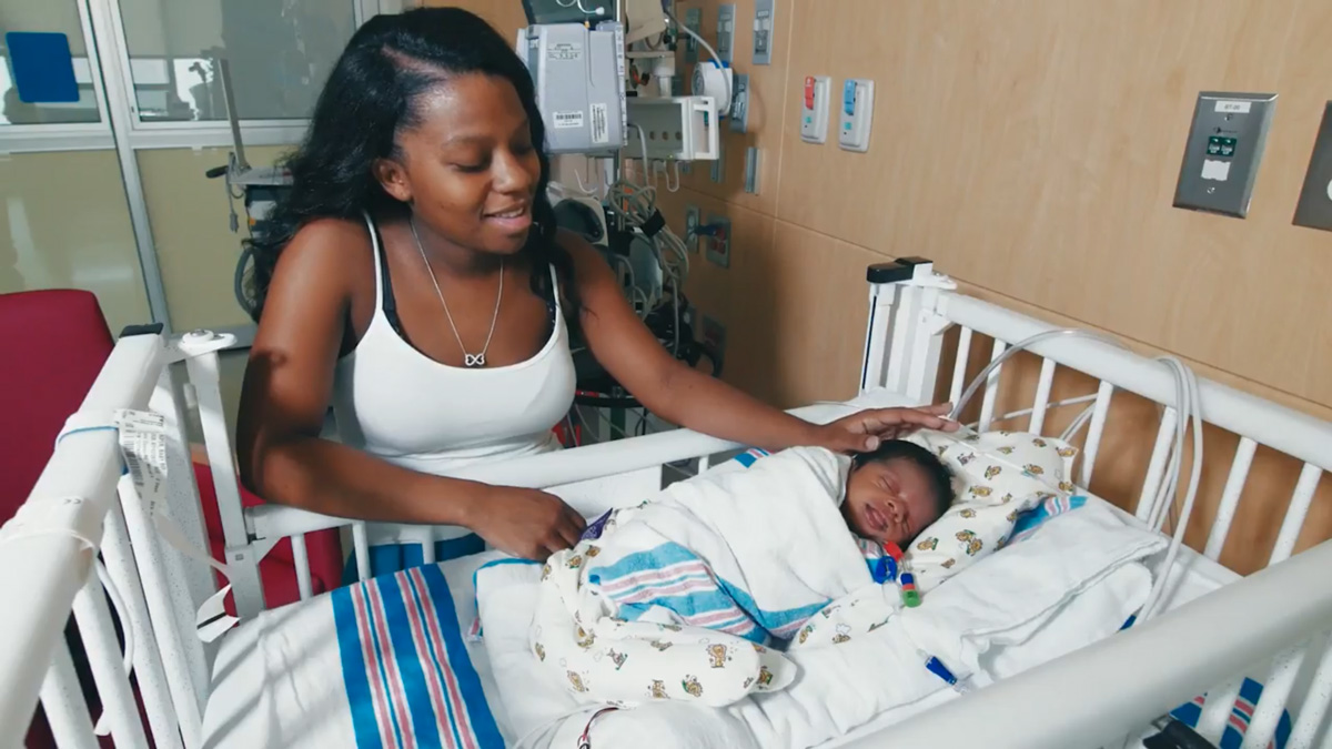Baby Carter with mother at Nicklaus Children's Hospital.