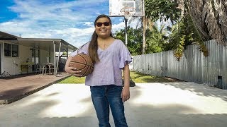Victoria holding a basketball.