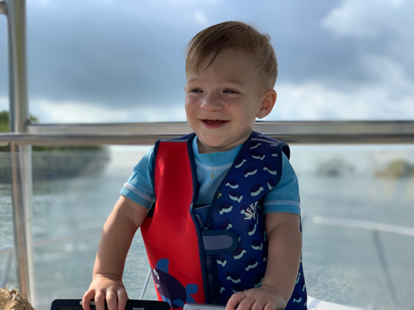 A happy Jackson at 3 years old, enjoying a boat ride