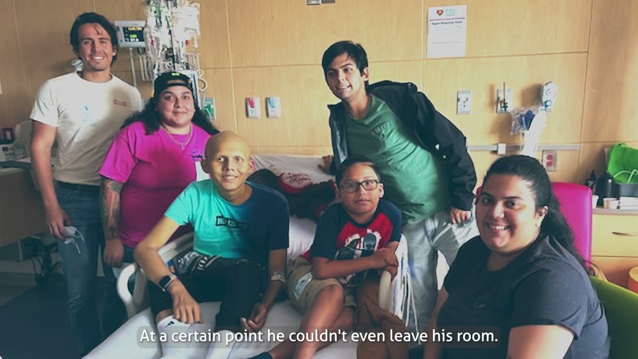 shawn surrounded by his family at the hospital.