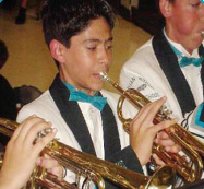 Alex playing the trumpet in a band.