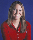 Portrait of Daniella wearing a red blouse. 