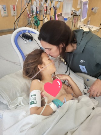 Emma's mother visiting her bedside