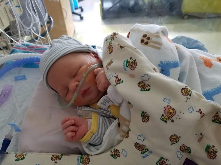 Baby Gabrien in a hospital bed sleeping. 